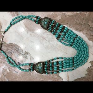 Turquoise-like statement necklace.